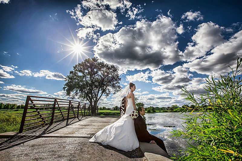 Bride and groom on bridge. Weddings at White Deer Run Golf Club Vernon Hills, Illinois.